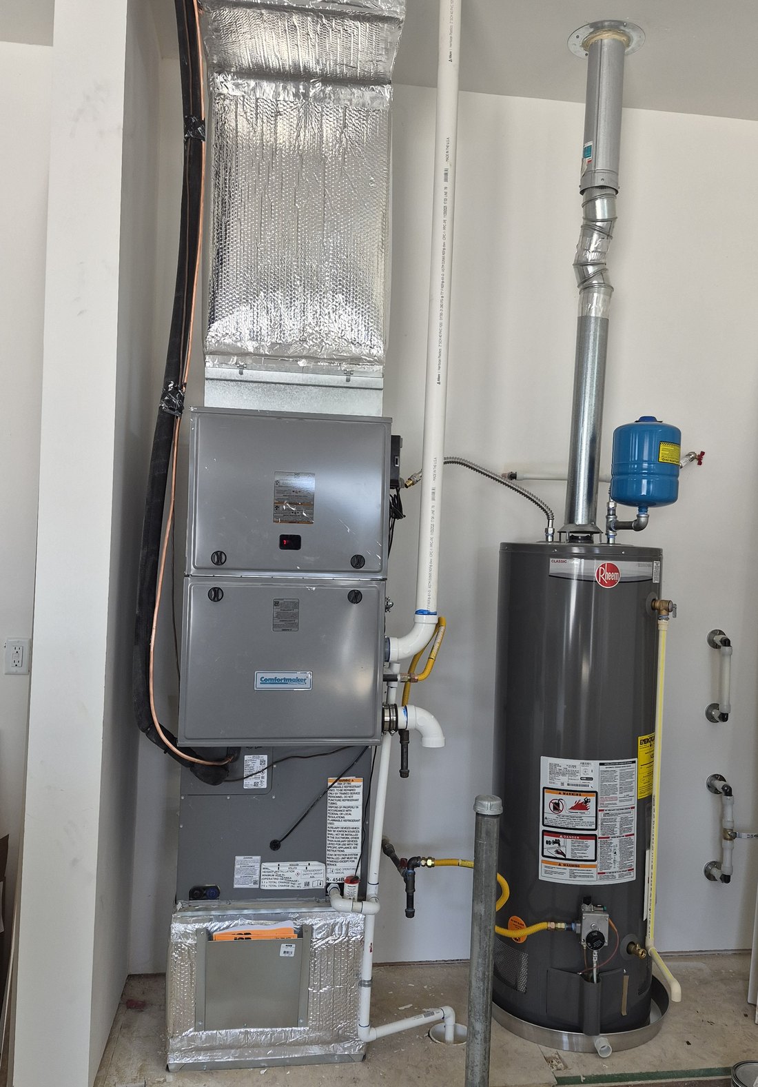 Comfortmaker 96% gas furnace and tank water heater in a finished mechanical closet, new build in Middleton, Idaho