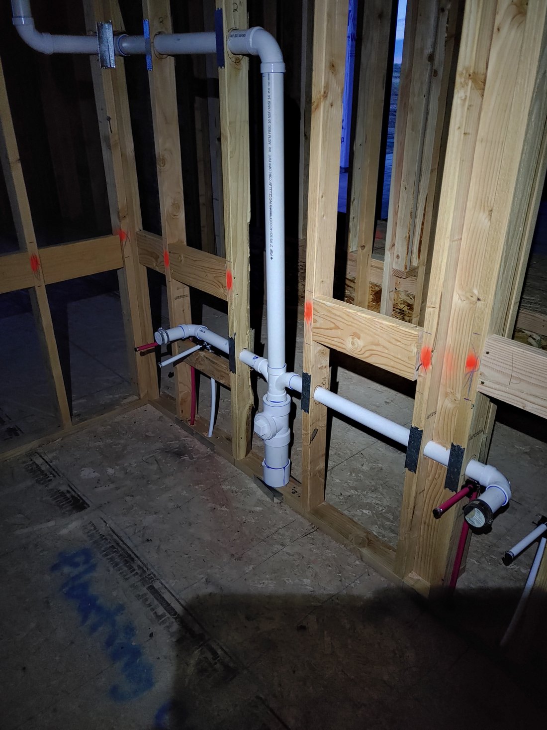 PVC drain, waste and vent piping roughed in through wall framing, new construction in Middleton, Idaho